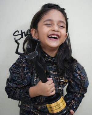 Zara Zyanna Instagram - SHE came home with HER. 
@she_awards 

Well, the little one was nominated for the “special appearance in film” category in SHE NAKSHATRAM AWARDS and the nomination took us by surprise cause we never felt what Zara has reached a milestone or this as achievement. Later, we received an update that the little one is a recipient and we had mixed feelings to receive it to be honest!

As parents we were discussing about the amazing talents in the industry and artists with spectacular performing skills and the reputation of the award. It has been handed over to deserving ones and we arrived at a place were we couldn’t wholeheartedly see ourselves there. The team was our eye opener. The conversation went like how special is the child’s presence and made us realise the point that it’s us who is about to hold back the appreciation for the kid’s effort. 

I still remember, Zara was just a 2 yr old when she appeared in a web series and a 3 yr old when she explored being expressive in front of camera of a feature film. As a 30yr old, I can’t see myself doing it back then or now. That needs an appreciation and who am I to stand in between that credit she was about to receive. 

Though we knew the child didn’t actually “act” but she was just being herself in the given situations.. there was a point where she knew it’s not “real” and They are filming to make a movie. And That’s commendable to us. She made us proud in the very moment she realised without our explanation that it’s just a reel scene and not a real world. And this award reminds me of these  moments, her adaptive skills, her brilliance, her charm, her trust on us and her cooperation. 

Sometimes we fail to appreciate the efforts of our dear ones. We are human, we take things for granted. We did get lost amidst the huge expectations that people have set on our head about achievements. But @she_awards reminded me, “All they need is a little pat on their back to believe in themselves to get there. Wherever they wanna be.” Instead of leading them, we have to just stand by them. Thanks for making us realise this by appreciating our kid. 🥹😍

Shot by: @praveen.jpeg (proud dad)
Written by mom @shanthu_27 😍