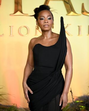 Anika Noni Rose Instagram - The way my team showed out on this @disney #Mufasa press tour has been thoroughly disrespectful.

Before I post ‘beauty shots’, I want to give a moment for this carpet situation. Because it was 32F, and that wind chill was not kind at all, but this looooook?!?! @ashistudio  brought the heat. 

Thank you, @ashistudio for draping me down for this London premiere. You knew only Queen attire would do.

Styled @jasonrembert 
Asst @thestylistguy 
Gown @ashistudio 
Shoes @louboutinworld 
Earrings 

Face @paintedbyesther 
Hair @seraiahartistry 
Color @ryanburrellhair 
 

#mufasa #lionking #milele #afia #fashion #ashistudio  #disney #littleblackdress🧡🦁