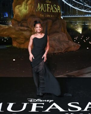 Anika Noni Rose Instagram - The way my team showed out on this @disney #Mufasa press tour has been thoroughly disrespectful.

Before I post ‘beauty shots’, I want to give a moment for this carpet situation. Because it was 32F, and that wind chill was not kind at all, but this looooook?!?! @ashistudio  brought the heat. 

Thank you, @ashistudio for draping me down for this London premiere. You knew only Queen attire would do.

Styled @jasonrembert 
Asst @thestylistguy 
Gown @ashistudio 
Shoes @louboutinworld 
Earrings 

Face @paintedbyesther 
Hair @seraiahartistry 
Color @ryanburrellhair 
 

#mufasa #lionking #milele #afia #fashion #ashistudio  #disney #littleblackdress🧡🦁