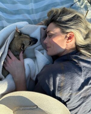 Arielle Vandenberg Instagram - My tiny Best Friend. Our Angel went to Heaven. 🕊️I don’t even know where to start and can’t believe I’m typing this. This is so painful. But I’ll start with the important stuff - I know she is running around Heaven with her new legs! I know she’s in Jesus‘s lap. I know she’s with my grandparents! I know they’re holding her and kissing her the way I would. I know she’s playing with her first owner and even her doggy parents! These thoughts bring me so much comfort and joy.  Stinky, you changed my life. You legit turned me into a mom.  I’ve never loved a dog like this before. Matt and I were truly so lucky.
You brought me so much joy! You could make me laugh like nothing else.  I have your little fleece sweater here that I’ve been pushing against my face, smelling it and using it to wipe my tears. This little sweater reminds me how tiny you were. I can’t believe such a magical energy could fit in something so tiny. The energy that you brought to this world was like no other. Your gift was initiating smiles in anyone that saw you. EVERYONE loved you. I loved carrying you around and intentionally putting you next to people that I felt needed a little joy in their life. 🥹 You turned Matt into a little dog loving softy. He has always been a gentle caring man but now he was your dad! He took such good care of you. All the way down to warming your paws after bringing you in from the wet grass. 😭 🐾 Stinky, thank you for your endless love. Thank you for staring at me 24/7. Thank you for always wondering where I was. Thank you for always finding me. Thank you for being such a good girl. 
As hard as this is I don’t like calling this a loss. Because it’s a major gain in the spiritual realm. Her beautiful spirit and delicate yet resilient soul will be dancing around forever! I don’t feel like I lost you. I truly feel like you’re right here next to me. You will always be a part of me. I will miss and love you forever and ever and ever my sweetest girl!🥹❤️ See you in my dreams Ticket!