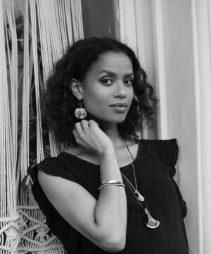 Gugu Mbatha-Raw Instagram - I loved being photographed by @helenachristensen wearing these @made51_unhcr pieces. As a style icon and fellow Goodwill Ambassador for @refugees, it felt so meaningful to be in front of her lens; wearing the Sahel collection that so beautifully celebrates the refugee stories behind the craftsmanship. 💜

When I visited Rwanda with UNHCR in 2018, I met Burundian refugee women in Mahama camp who were crafting extraordinary pieces. Seeing their sense of community and pride as they worked together was unforgettable. These weren’t simply objects; they carried hope, strength and the transformative power of resilience in the hands that made them. 

Visit @made51_unhcr to see the full range of hand-crafted gifts made my refugee artisans.

Have a magical festive season! ✨