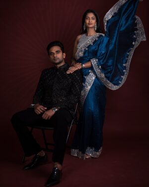 Keerthi Pandian Instagram - For the Kalyan Jewellers Navratri Puja ✨

On Ashok: 
Wearing @creativestop_official @fbo.pr.communication 
M&H -  @thestylinghousesalon @chris_drifter_girl @_.ajuhhh._ 

On Keerthi: 
Wearing @swathiveldandi_official 
Earrings and ring @sangeetaboochra @chamierschennai 
Bangle @tribebyamrapali @amethystchennai
MakeUp @sofdoesmakeup_ from @thebridebar 
Hair @mani_stylist_ 

Styled by @malinikarthikeyan 
Shot by @palaniappansubramanyam 

#KalyanJewellers #AshokSelvan #KeerthiPandian #styledbymalini