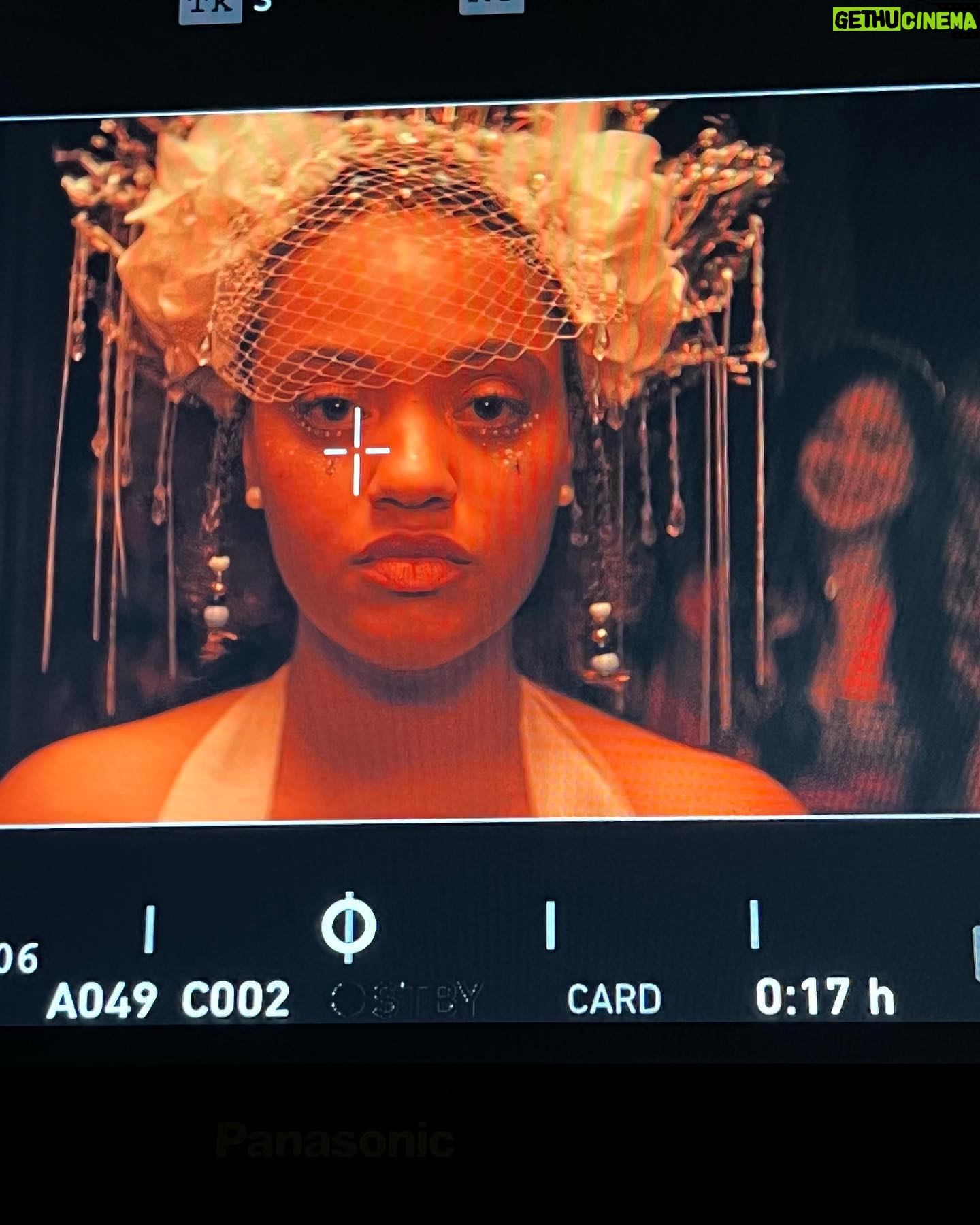 Kiersey Clemons - 3 Likes - When I read The Young Wife script I saw Celestina with glitter tear drops on the day of her non-wedding wedding reflecting the mask she feels the pressure to wear carrying the weight of the inevitable future. I listened to a lot of Leon Bridges who plays my soon to be husband. I heard Tout Fout L’camp at a clown show in Montreal in 2019. I listened to it before most scenes. Tout Fout L’camp translates to “Everything’s falling apart!!” Sheryl Lee Ralph, who plays my mom spoke French in the movie and I imagined Celestina yelling the song with her mother when things weren’t so great - they’d end up falling into laughter. Celly went on to share it with Cookie played by Judith Light. They’d sing, scream and laugh. Jumatatu led us in a dance to this song after I played it for Tayarisha - our prompt was what is a song that describes your character?