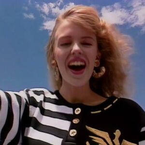 Kylie Minogue Instagram - I Should Be So Lucky, lucky, lucky, lucky, lucky, WAIT!!! How many times do I sing ‘Lucky’ in ISBSL. For its 37th birthday I’m going to find out. Please hold …

Won’t be long …

Wow, there’s a lot of them ….

GOT IT 🎉 Just a lazy 57 times 🤯😬💖 Happy Birthday to the song that took me around the 🌎 and then some!