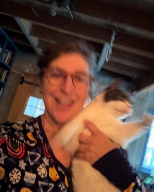 Mayim Bialik Instagram - These Little Sleepies Chanukah PJs are so incredibly soft that I thought my softest cat would love posing with me in them—we’d feel like we were one. 🤦‍♂️ Spoiler: She did not enjoy the photo shoot, but the pajamas are just as cozy and soft as Addie! @littlesleepies