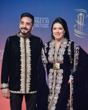 Mounia Lamkimel Instagram - @marrakechfilmfestival 
مع العمر @naamanadil 

حطيت الالبوم لي وصلني كااامل حيث ماعرفتش شنو نختار🫣 شكرا بزاااااف @tendancevision 
بغيت نقول شكرا لادارة المهرجان على حفاوة الاستقبال شكراً للاعلام المغربي على التتبع والمساندة 🇲🇦♥️
شكرا العزيزة الغالية @zor.creations  على اللبسة الهماوية لي تمتعت وانا لابساها ورغم الظروف الصحية والانشغالات إلا انك كنتي متمكنة من حرفتك ولبستيني أنا وعادل على أكمل وجه
شكرا من القلب اخويا وصديقي المتميز @halim_barakat_official لي ماكنتيق إلا فيه ولي شرف على الماكياج والشعر فوقت خرااافي وعطى نتيجة حبييييييتها😌♥️