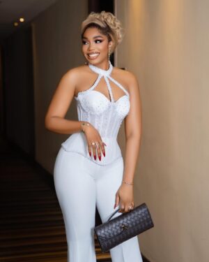 Sharon Ooja Instagram - MRS NWOKE😍

Outfit by my babe @veekeejames_official @shoperikan 
Hair @pelo_raw_humanhair 
Hairstyles by @bernardsmiless 
Photography @bangraphy 
Infinity ring @bozdiamonds 
Last night at #toeallwhiteparty2024