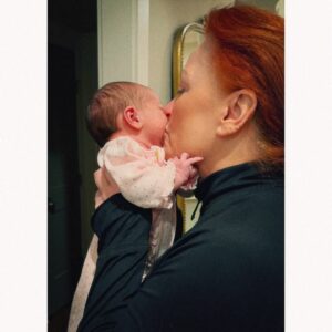 Wynonna Judd Instagram - Camera roll crumbs from 2024. Looking back with a grateful heart!!! 

1- Got to play in Alaska again 🩵
2- Married off the final Moser son 💍
3- The best group to be stuck in an airport with ✈️
4- Sparkles. Duh. ✨
5- Meet Moonshine! 🐮 Kaliyah loves giving him treats!
6- BTS 📸
7- @starletjudd is a really good sport 💕
8- Hazel Claire has already stolen my heart 🎀
9- We love Austin!!! 🎶
10- Ryman selfies with @ashleymcbryde 🤳
11- Farm life. 🐔
12- I 💚 @laineywilson
13- Girls night out @robertswesternworld 🥂
14- Spent time with @officialstetsonwright and his sweet family 🤠
15- Princess Kaliyah’s first time trick or treating! 🎃
16- Boomer.🥤
17- Nonie’s little sous chef. 👩🏼‍🍳
18- First time using my @kubotausa mower. 🚜
19- Cooking in stage clothes. What else is there to do? 🍅
20- No caption needed. 😆🏓