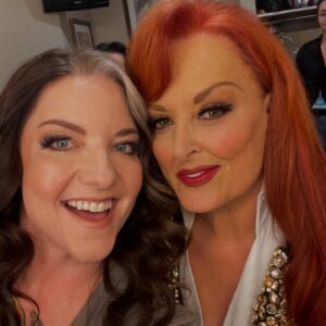 Wynonna Judd Instagram - Camera roll crumbs from 2024. Looking back with a grateful heart!!! 

1- Got to play in Alaska again 🩵
2- Married off the final Moser son 💍
3- The best group to be stuck in an airport with ✈️
4- Sparkles. Duh. ✨
5- Meet Moonshine! 🐮 Kaliyah loves giving him treats!
6- BTS 📸
7- @starletjudd is a really good sport 💕
8- Hazel Claire has already stolen my heart 🎀
9- We love Austin!!! 🎶
10- Ryman selfies with @ashleymcbryde 🤳
11- Farm life. 🐔
12- I 💚 @laineywilson
13- Girls night out @robertswesternworld 🥂
14- Spent time with @officialstetsonwright and his sweet family 🤠
15- Princess Kaliyah’s first time trick or treating! 🎃
16- Boomer.🥤
17- Nonie’s little sous chef. 👩🏼‍🍳
18- First time using my @kubotausa mower. 🚜
19- Cooking in stage clothes. What else is there to do? 🍅
20- No caption needed. 😆🏓