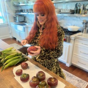 Wynonna Judd Instagram - Camera roll crumbs from 2024. Looking back with a grateful heart!!! 

1- Got to play in Alaska again 🩵
2- Married off the final Moser son 💍
3- The best group to be stuck in an airport with ✈️
4- Sparkles. Duh. ✨
5- Meet Moonshine! 🐮 Kaliyah loves giving him treats!
6- BTS 📸
7- @starletjudd is a really good sport 💕
8- Hazel Claire has already stolen my heart 🎀
9- We love Austin!!! 🎶
10- Ryman selfies with @ashleymcbryde 🤳
11- Farm life. 🐔
12- I 💚 @laineywilson
13- Girls night out @robertswesternworld 🥂
14- Spent time with @officialstetsonwright and his sweet family 🤠
15- Princess Kaliyah’s first time trick or treating! 🎃
16- Boomer.🥤
17- Nonie’s little sous chef. 👩🏼‍🍳
18- First time using my @kubotausa mower. 🚜
19- Cooking in stage clothes. What else is there to do? 🍅
20- No caption needed. 😆🏓