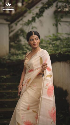 Amrutha Saju Instagram - Channelling my inner goddess with this divine floral saree. A dream to drape, this semi-tussar saree from Pulimoottil Silks combines contemporary florals with a traditional gold border. Can’t wait to flaunt this elegant outfit for Onam!

Outfit - @pulimoottil.silks 
DOP - @premsampaul 
Stylist - @ladyvalayil 
MUA - @lushandluxbyak 
Location - Hill palace 

#PulimoottilSilksThodupuzha #PulimoottilSilks #Onam2024 
#Onamoutfits #Festivalwear #KeralaSarees