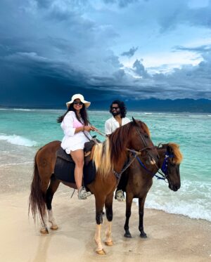 Bhavini Purohit Instagram - Golden hour, ocean breeze, and a ride into the sunset—just us, the waves, and our horses in paradise w/ @wonderfulindonesia 
.
{Travel ,trend,island,couple,couplevideos,gilliT,love,experiences,crazy}
.
#influencer #love #crazy #experience #bali #gilliislands  #trending #trend #love #balitrip #beach #beachlife #horse #horseriding