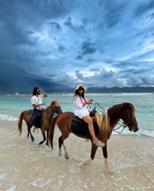 Bhavini Purohit Instagram - Golden hour, ocean breeze, and a ride into the sunset—just us, the waves, and our horses in paradise w/ @wonderfulindonesia 
.
{Travel ,trend,island,couple,couplevideos,gilliT,love,experiences,crazy}
.
#influencer #love #crazy #experience #bali #gilliislands  #trending #trend #love #balitrip #beach #beachlife #horse #horseriding