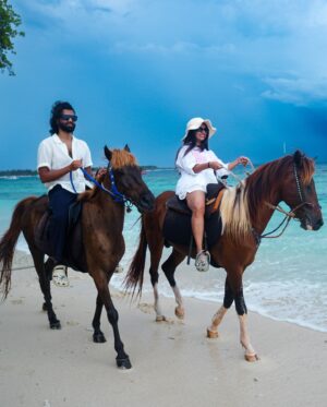 Bhavini Purohit Instagram - Golden hour, ocean breeze, and a ride into the sunset—just us, the waves, and our horses in paradise w/ @wonderfulindonesia 
.
{Travel ,trend,island,couple,couplevideos,gilliT,love,experiences,crazy}
.
#influencer #love #crazy #experience #bali #gilliislands  #trending #trend #love #balitrip #beach #beachlife #horse #horseriding