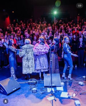 Imelda May Instagram - Last night @theatremoat we celebrated 
with the full spirit of Brigid at ‘Nothing Compares’
Imbas was flowing strongly and so it was a special night. 
Ever supportive  @hotpressmagazine invited us to @theatremoat and our hearts opened as @rachel_skinc @lemoncello___ @unahealy @mariadoylekennedy 
artistry and pure talent blew us all away. 
Nothing prepared me for Ireland’s First Lady 
Sabrina Higgins rousing, truthful and heartfelt speech.
My God she’s a special woman. 
@guitardarling accompanied me with flair and ease. 
The brilliantly slick @thewhitmore hosted with such warmth as always she inspired the audience to be just so open and giving.  Friendship, love, strength, vulnerability, connection all made themselves heard. 
We closed the night with our sister @sineadoconnorofficial words in our hearts and on our tongues, 
Thanks to all including @kildarecountycouncil @jasondohertyphotography @abigailr_photos 
as I wore my Palestinian dress made by @tatreezsisters thinking of all those living in fear and devastation and praying hard for peace and hope..
Because of last night I was in a good place today to feel Brigids quiet power while simultaneously wearing three of my favourite scarves by @loubrennandesign @victoriamaryclarke @jenniferrothwelldesign as 
my Brat Bhride (Brigids Cloak) that I hung on a bushel last night to be blessed by the passing spirit of Brigid and wrap myself in all year when in need of healing. 
Imbolc a blessings upon us all as we spring towards 
new life, new beginnings, love, light and hope.
Love Imelda x