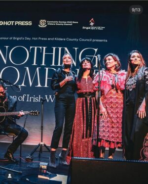 Imelda May Instagram - Last night @theatremoat we celebrated 
with the full spirit of Brigid at ‘Nothing Compares’
Imbas was flowing strongly and so it was a special night. 
Ever supportive  @hotpressmagazine invited us to @theatremoat and our hearts opened as @rachel_skinc @lemoncello___ @unahealy @mariadoylekennedy 
artistry and pure talent blew us all away. 
Nothing prepared me for Ireland’s First Lady 
Sabrina Higgins rousing, truthful and heartfelt speech.
My God she’s a special woman. 
@guitardarling accompanied me with flair and ease. 
The brilliantly slick @thewhitmore hosted with such warmth as always she inspired the audience to be just so open and giving.  Friendship, love, strength, vulnerability, connection all made themselves heard. 
We closed the night with our sister @sineadoconnorofficial words in our hearts and on our tongues, 
Thanks to all including @kildarecountycouncil @jasondohertyphotography @abigailr_photos 
as I wore my Palestinian dress made by @tatreezsisters thinking of all those living in fear and devastation and praying hard for peace and hope..
Because of last night I was in a good place today to feel Brigids quiet power while simultaneously wearing three of my favourite scarves by @loubrennandesign @victoriamaryclarke @jenniferrothwelldesign as 
my Brat Bhride (Brigids Cloak) that I hung on a bushel last night to be blessed by the passing spirit of Brigid and wrap myself in all year when in need of healing. 
Imbolc a blessings upon us all as we spring towards 
new life, new beginnings, love, light and hope.
Love Imelda x