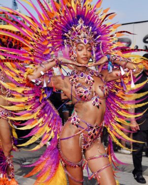 Jourdan Dunn Instagram - Carnival Chronicles 🩷🧡💛💜

Costume design @eccdesigner 
Band @ucomcarnival 
📸 @luceroglow