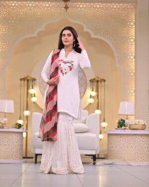 Nida Yasir Instagram - My only cotton fusion outfit for this eid. Pure cotton kurti with colourful handwork and delicate gota paired up with indian chiffon gharara having sequence n gota on it fulfills festivity requirement. And as the outfit is all in white so to compliment it the dupatta has been dyed in 4 different colors. Wear it and have fun.
@ynida.clothing