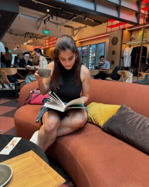 Priya Bapat Instagram - Doing what I like the most 📖☕️🎧 

#sweeleemusiccompany #singapore #clarkyquay