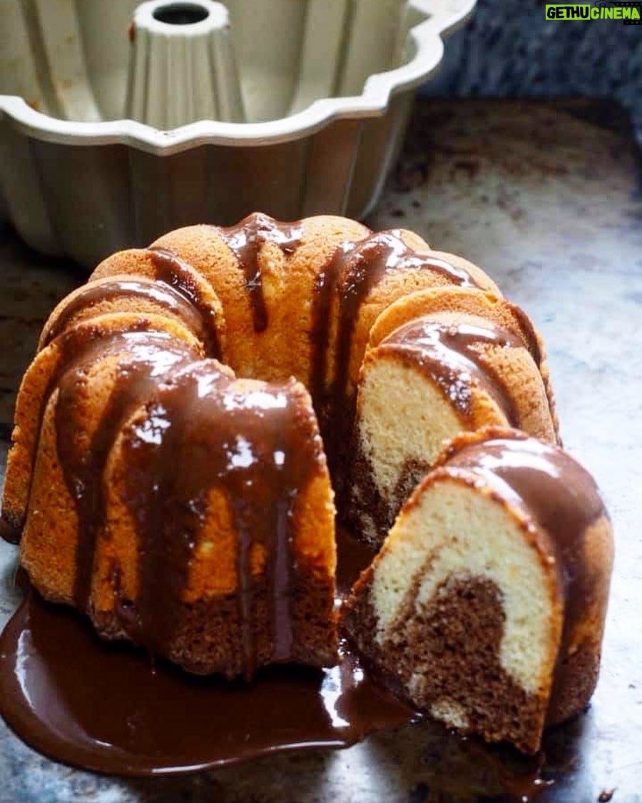 Silvia Colloca - 0.9K Likes - Just my favourite tea cake, Marbled Ciambellone
INGREDIENTS:
3 eggs
200 gr (1 cup) of caster sugar
250 gr (2 and 1/3 cups) of self-raising flour
2 tablespoons of corn starch
60 ml (1/4 cup) of grape seed oil (or lightly scented olive oil)
125 gr (1/2 cup) of Greek yogurt
1 teaspoon of vanilla extract
Melted chocolate for serving (optional)
How To
1. Whisk eggs and sugar until pale and creamy.
2. Add the oil , Greek youghurt and the vanilla
3. Gently fold in the flour and the corn starch, well sifted. Mix until the batter is combined.
4. Pour 2/3 of the mix into a ring-cake tin (I used a silicon one so I didn’t have to grease it.). 5. Add 3 tablespoons of bitter cocoa to the remaining cake batter and mix until smooth.
6. Dollop the cocoa mix on top of the vanilla mix and , using a fork or a chopstick, swirl the two batters together.
7. Bake in a preheated 170 C (340 F) oven for about 40/45 minutes, or until a skewer comes out clean. Let the cake cool in its tin for about one hour before serving, drizzled with melted chocolate, if liked.