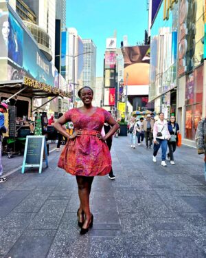 Wunmi Mosaku Instagram - I definitely acted a fool when I saw myself on a billboard in Times Square! Lost an earring jumping around so much 🤪
 #Passenger on @britboxtv 

Dress designed by Me 🥰 and made by @alef_byati
Styled by @shameelahhicks
💇🏿‍♀️ @cheryltbergamyhair
💄 @killahcamz