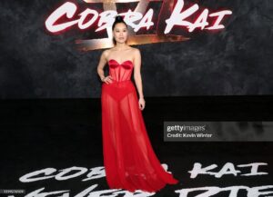 Alicia Hannah Instagram - cobra kai never dies❤️❤️❤️❤️ 

premiere look
styled by @benjaminholtrop 
makeup @karayoshimotobua 
hair @yumabastet 
style assist @emilykejohnson
​gown - @coral_castillo
jewelry - @kylechandesign @stephaniegottlieb
shoes - @charleskeithofficial