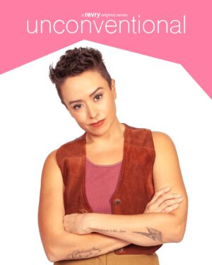 Briana Venskus Instagram - Meet Eliza... the no-nonsense, loving partner navigating life and family in Unconventional. Portrayed by Briana Venskus (@houseofvenskus). Stream Unconventional NOW on Revry.

#unconventional #unconventionalseries #brianavenskus #lgbtqseries #lgbtseries #revry #streamqueer #revryoriginal