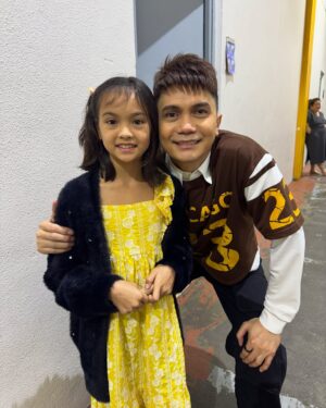 Helga Krapf Instagram - The face you make when you get to experience mommy’s old stomping grounds. 😍 

Amelie has been so curious about my life as an actress, asking so many questions about behind the scenes, in between takes, interviews, and the whole acting process. She asked if she can watch @itsshowtimena when we visit PH and her Ninong @augustbenitez granted her wish like a true fairy godfather. 🪄🤭 Thank you so much Sir August! 🙏🏼

Thank you also to her Ninong @teddspotting na pinaghandaan ang german, shooked si Amelie sayo! Lol Also to her Ninong @vhongx44 for seeing her backstage. 🫶

To Ninong @thirdeeduran , Tita @alyannaaranezz and Tito @deanscenes for coming and vlogging (follow niyo siya sa tiktok 🤣) 

And to the staff and kuyang marshalls of Abs who are as respectful and kind as I remember them to be. Truly felt like coming back to your former home. 🏠