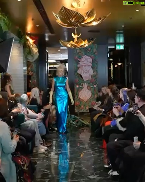 Jane Moore - 6.3K Likes - Deeply flattered to be asked to model for sustainable fashion designers Vin Omi @vinandomi at their ‘Kaos’ runway show at The Other House last night - what an experience! Loved every second of it. Among the professional young catwalk models, Prue Leith and I strutted our stuff for women ‘of a certain age’ and showed you’re never too old to love fashion in all its forms.
This is a passion project for Vin and Omi who work closely with, among others, King Charles to make clothes recycled from the everyday stuff we throw away. Some of the outfits were made from recycled products from the Sandringham estate and my spectacular, electric blue dress was made from recycled cans collected from Birmingham parks by the homeless. Check out their website and account to see the history of the amazing sustainability work they do here and globally.
It was a pleasure to be a part of this and I got to keep the eye-catching dress so you’ll be seeing me recycling it at plenty of forthcoming events!
