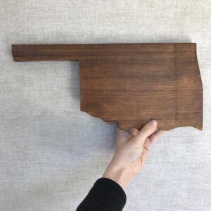 Laura Spencer Instagram - I don’t think I ever posted about this thoughtful gift from @emilydianaruth. Emily and her Dad made this for me out of a barn board that is over 100 years old. They carved out the shape of my home state, Oklahoma, where I lived my entire life before moving to Los Angeles. It is where most of my family resides and some of my friends still do. This piece is a beautiful reminder of home and of my loved ones. My family is about to embark on a very difficult week together next week. Throughout this journey, our friends and family have really shown up and been incredibly helpful, thoughtful, and present in many different ways. Phone calls, hangouts, pet sitting, house sitting, hikes, rides, emails, letters, photos, trips, meals, drinks, laughs, checking in. This post is a thank you to all of them. I don’t think I could have survived this time without them and my love @michaeljackgreenwald. Surround yourself with people who will stay by your side when you are going through your worst and for whom you would do the exact same. Life’s too crazy to go at it alone. ❤️