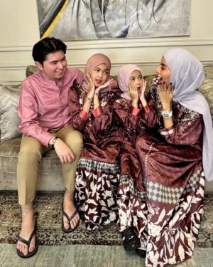 Olla Ramlan Instagram - “Children do not ask to be born into this world, yet they arrive full of wonder, hope, and endless possibilities. It is within the warmth of family that they learn their worth, their dreams take flight, and their hearts find their first understanding of love.”

Our Dress - @vivizubedi @mrsvivi 

Happy Eid al-Fitr! 🔥
