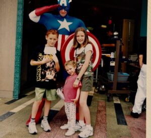Shira Haas Instagram - A few months ago, I stumbled upon this photo while flipping through old family albums. Five-year-old me, standing excitedly next to my siblings—captured by my parents—right beside none other than Captain America.

This was during a trip made possible by Give Kids The World, an incredible organization that grants critically ill children and their families week-long wish vacations, completely free of charge.

Little did she know…

Enjoy the film & here’s to full circles. 🥂❤️