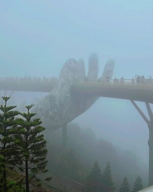 Shubhi Garg Agarwal Instagram - // The mighty Golden Hands Bridge 🌟🌁

The entire Bana Hills were covered in fog and we were freezing!!!! 🥶 As we walked on the bridge, we realised the authorities have removed the glass ramp and have replaced it with wooden flooring for the tourists to walk comfortably.
But I was so excited to see the glass ramp. Bummer! 😔

Nevertheless, we enjoyed our experience as we lived the magical moments at this iconic site. 🤩 
PS : The best time to visit Bana Hills is during the sumner if you want to see the greenery around and the bridge clearly.

There’s so much more at Bana Hills to explore. Taking you through the trip in my next posts. Stay tuned.
.
.
.
.
.
.
.
.
#pickeratpace #indianblogger #indiantravelblogger #vietnam #vietnamtravel #vietnamtrip #banahills #banahillsvietnam #goldenhandsbridge [vietnam bana hills, bana hills vietnam, golden hands bridge vietnam, indian travel influencer, danang vietnam]