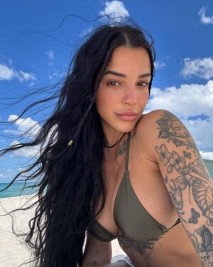 Valerie Bragg Instagram - Beach day 🏝️ @fashionnova 

Wearing Summer On The Coast 2 Piece Swimsuit and Pamela Puka Seashells Crochet Ruched Cover Up Skirt 

Link in bio to shop ❤️