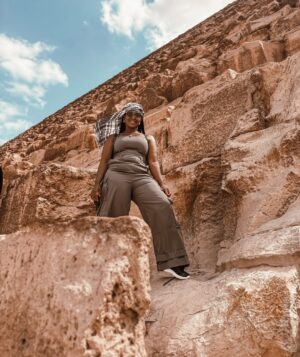 Catherine Kamau Instagram - Exploring The  ancient majestic Giza Pyramids  was a once in a life time adventure that truly exceeded my wildest expectations. The history behind the work that went into designing and construction the pyramids is mind blowing. I cross off this bucket list with overwhelming joy and pride thanks to my best friend & my odogwu 😂❤️.

#giza 
#blacktravel