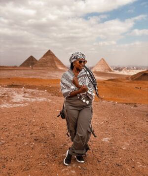 Catherine Kamau Instagram - Exploring The  ancient majestic Giza Pyramids  was a once in a life time adventure that truly exceeded my wildest expectations. The history behind the work that went into designing and construction the pyramids is mind blowing. I cross off this bucket list with overwhelming joy and pride thanks to my best friend & my odogwu 😂❤️.

#giza 
#blacktravel