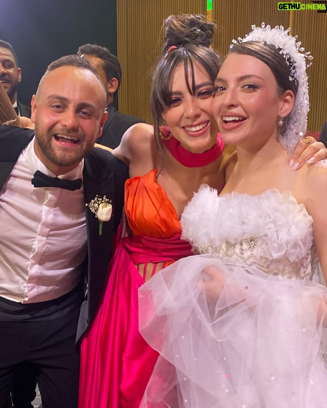 Dalia Shawky - 72K Likes - 900th post goes to celebrating love, with all its heart-melting beauty, dancing hearts and laughter intertwined with tears of joy. Here’s to my childhood bestfriend’s wedding, our Cindrella ~ Faru7i. 💗🧡

Thankful for my beautiful team: 
Custom made butterfly bridesmaid’s dress by the wonderful: @chl_maisonleon
MUA, inspired by the sunset: the lovely @sandrawilliammakeupartist 
Hair: @mostafa.elmasry.9