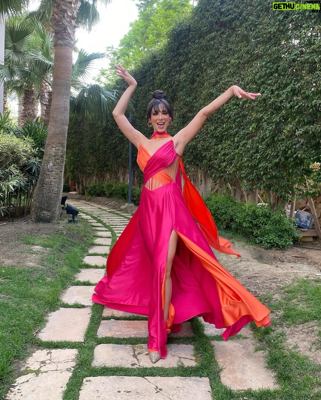 Dalia Shawky - 72K Likes - 900th post goes to celebrating love, with all its heart-melting beauty, dancing hearts and laughter intertwined with tears of joy. Here’s to my childhood bestfriend’s wedding, our Cindrella ~ Faru7i. 💗🧡

Thankful for my beautiful team: 
Custom made butterfly bridesmaid’s dress by the wonderful: @chl_maisonleon
MUA, inspired by the sunset: the lovely @sandrawilliammakeupartist 
Hair: @mostafa.elmasry.9
