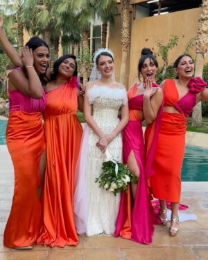 Dalia Shawky Instagram - 900th post goes to celebrating love, with all its heart-melting beauty, dancing hearts and laughter intertwined with tears of joy. Here’s to my childhood bestfriend’s wedding, our Cindrella ~ Faru7i. 💗🧡

Thankful for my beautiful team: 
Custom made butterfly bridesmaid’s dress by the wonderful: @chl_maisonleon
MUA, inspired by the sunset: the lovely @sandrawilliammakeupartist 
Hair: @mostafa.elmasry.9