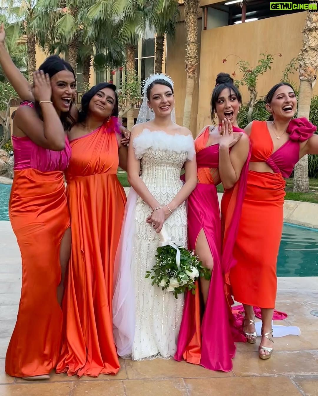 Dalia Shawky - 72K Likes - 900th post goes to celebrating love, with all its heart-melting beauty, dancing hearts and laughter intertwined with tears of joy. Here’s to my childhood bestfriend’s wedding, our Cindrella ~ Faru7i. 💗🧡

Thankful for my beautiful team: 
Custom made butterfly bridesmaid’s dress by the wonderful: @chl_maisonleon
MUA, inspired by the sunset: the lovely @sandrawilliammakeupartist 
Hair: @mostafa.elmasry.9