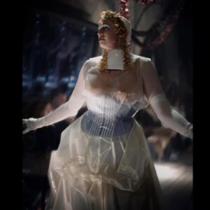 Gwendoline Christie Instagram - Maison Margiela Artisanal 2024 Collection by @jgalliano .

Look 44
Overdress and an underdress in white silk taffeta with retrograding in seeping silicone coating worn over a blue-and-white striped cotton poplin stripe-tease corset and a white silk knitted bodysuit, underpinned by a silicone hip prothèse matching the skin tone of the  muse. A porcelain-imitation moulded leather breastplate, a white leather small top-handle Snatched bag, white silk stockings, and white leather pumps by Christian Louboutin for Maison Margiela enveloped in white stocking material. White paper maché, clay, string and stretch-tulle lay doll gloves overlaid in white silk jersey.
Model @gwendolineuniverse

@maisonmargiela 🤍
