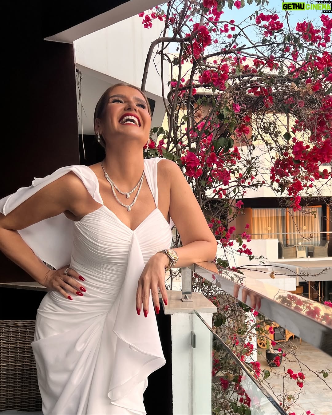 Hana Sheha - 21.2K Likes - White dress, red lipstick, Diamond Set ..
It must be illegal 🤍🤩❤️
Opening ceremony @fiffs.officiel
Thank you @dinouche.designs for my total look and diamonds 💎💎💎
Make up and hair by the talented @rimmake_up