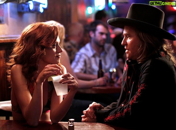 Hilarie Burton - 83.6K Likes - The sweetest man.
I played @valkilmerofficial ‘s girlfriend in a movie back in 2009. The script called for us to have a fairly rowdy love scene that got interrupted by a phone call. I’d just come off of OTH where I was always put in some kind of compromising position….so it was just work as usual.
But then I got to set the day we were going to be shooting that scene and there was a scramble happening. “Val wants to change the scene.”
Huh?
“It’s not interesting,” he said. A gratuitous sex scene with a younger woman didn’t service the story or the character. It said nothing about the relationship and why either of our characters were in it. Instead, Val sent someone out to a local restaurant to pick up a huge tub of ribs. And so, as the camera panned up from the floor, our moans were those of two people, comfortable and indulgent, tangled up in bed and unfettered by the mess, elbows deep in North Carolina’s finest bbq.
It was infinitely more interesting and I felt so safe and cared for by that man. It would have been easy to phone it in and just go with the stereotypical way women have been seen in film. Rather than the scene playing on my naked back, he turned me toward the camera. He made the scene about us instead of using me as a prop. That one day at work rewired my brain.
Val was kind to me. A thoughtful artist. I bought some of his paintings a few years back. I hope every young actor has a Val in their life. That movie was a magical experience.
#bloodworth