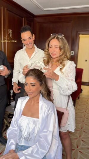 Laila Elwi Instagram - #HappeningNow What a beautiful day!🥰 When @lailaelouiofficial is your aunt 😍🤍 Congratulations to the most beautiful couple 💞 Hady & Hana 🤍
—————————————
▪︎ Wedding Media Coverage @egyptianweddingsofficial 
▪︎ Wedding Planner: @bypasantelwardany @moukhtartaha 
▪︎ Makeup artist: @nesmamansourmakeup 
▪︎ Hairstylist : @alsagheersalons 
▪︎ Photography: @eslamsaleeh 
▪︎ Videography: @xfilmmaker 
▪︎ Bouquet: @bouquet_bride_by_nour_ali 
▪︎ Fire: @ahmedessamfire 
▪︎ Hotel: @jwmarriottcairo 
▪︎ Bride: Hana
▪︎ Groom: Hady
——————————————
-
-
-
-
-
-
-
-
-
-
-
-
-
———————————‐-——
#egyptianweddings #weddings #cake #makeup #love #bride #groom  #makeupartist #brideoftheday #fashion #weddingdress #weddinggown #groomoftheday #hair #headpiece #hotel #flowers #followme #dress #likeforlike  #cairo #egypt  #like4like #egyptiandesigners #egyptianbride @egyptianweddingsofficial 
——————————————
#egyptian_weddings_team