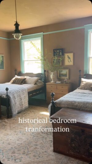 Lauren Liess Instagram - A historical bedroom transformation at @battlerunfarm 🤎 hellooo color!! | we said goodbye to the chimney   woodburner that were taking up valuable space in the bedroom and made room for guests with 2 queen “saltwater” beds (from my collection with Woodbridge Furniture) 🤎 Mottled brown Limewash and robin’s egg blue woodwork were a bit of a stretch for our client (Thank you for trusting Anne! 🫶) but we absolutely love how it turned out!!! Antique trunks at the ends of the beds with a vintage rug, chair (not seen) and art are paired with new bedding and dresser for a timeless collected feel. Can’t wait to show you the full house tour!! | interior design by Lauren Liess Interiors | Renovation by @welshconstruction