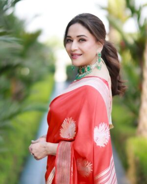 Madhuri Dixit Instagram - Golden hour, golden glow, and a heart full of sunshine. ☀️ 

#tuesday #tuesdaythoughts #sareelove #sunshine #photoshoot #photooftheday