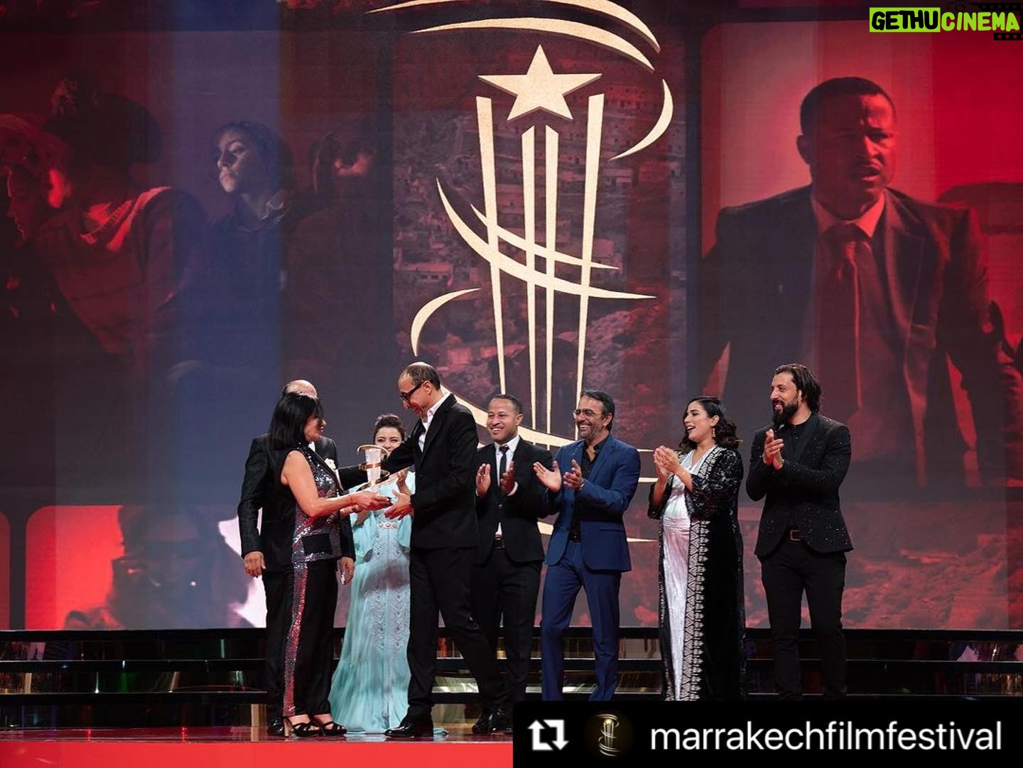 Nadia Kounda - 2.5K Likes - Une soirée auprès de mes chers partenaires de jeu pour rendre hommage au Realisateur Faouzi bensaidi, l’ami ♥️ et le cinéaste ♥️
#Repost @marrakechfilmfestival with @use.repost
・・・
TRIBUTE NIGHT 💫 : Faouzi Bensaïdi’s enchanting aura filled the room as cinema family honored him with a 25-year legacy Golden Star. Bensaïdi was welcomed on the stage of the #marrrakechfestival by Nezha Rahil, Nadia Kounda, Hajar Graigaa, Fehd Benchemsi, Rabii Benjhail, Mouhcine Malzi and Abdelhadi Talbi. #20thedition
ليلة التكريم 💫: ملأت نسمة فوزي بنسعيدي الساحرة الغرفة حيث كرمته عائلة السينما بالنجمة الذهبية على 25 عامًا من فنه. وكان في استقبال بنسعيدي على خشبة #مهرجان_مراكش نزهة راحيل ونادية كوندا وهاجر كريكع وفهد بنشمسي وربيع بن جهيل ومحسن ملزي وعبد الهادي الطالبي. #الدورة_العشرون