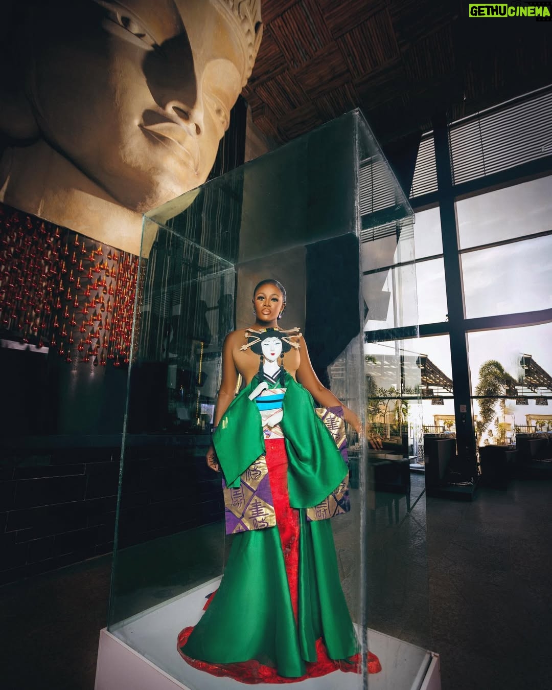 Nana Akua Addo - 16.2K Likes - A GEISHA
•
Today , I exhibit the ART & CULTURE of JAPAN; THE GEISHA.
The Japanese word GEISHA literally means “ART PERSON”.
I embody ART in its Fullest, EXPRESSION ELEMENTS, COLORS, BEAUTY, GRACE and DISCIPLINE.
I am so honored to be wearing the JAPANESE GEISHA, an embodiment of WOMANHOOD, UNIQUE BEAUTY, GRACE and MYSTERY.
Dress: @carysantiago7
Jewelry: @sparkles_jewellerygh
#amvca8 #amvca22
