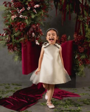 Rianti Cartwright Instagram - Nainggolan’s 2024 Christmas Card ♥️. May your homes be filled with peace and love this season🎄🎼🕊️. 

Photo: @journeybysl @gidwinata
Styled by: @jealangel
MUA: @njsmakeup
Rianti’s dress: @monalease.id
Cara’s dress: @kakapofficial
Decoration: @artistefloral
Studio: @spacebynara