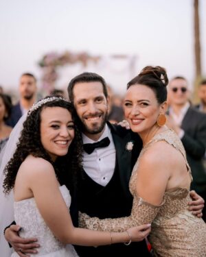 Riham Abdel Ghafour Instagram - My gorgeous niece got married to this wonderful man
God bless you habaybiiii
IsA endless love and happiness 🤍🤍
@mennaraafat 
@mostafayelaidy 
My look
Dress @temraza 
Jewelry @dimajewellery 
Make up @farag_dahy82 
Hair @mahmoud_hair_stylist 
thank you @elmawardyjewelry 
  for making our bride shines even more 💎